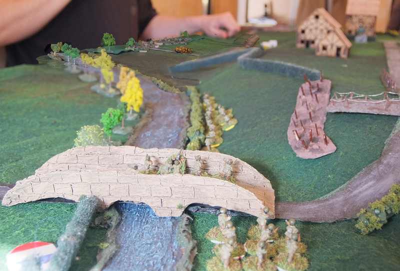 ( a U.S. Infantry squad came from the bridge, trying to seize the small village. My reinforcements were also coming, we can see a Stug in the distance)